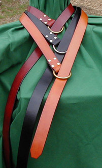 A basic element of any Medieval or Renaissance costume, our ring belts are crafted of fine bridle leather. Shown here in chestnut, black and dark tan.