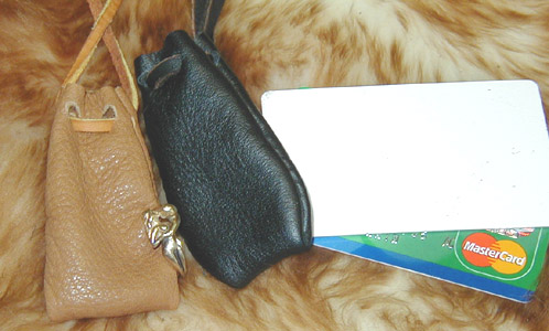 Hand Stitched Reliquary Neck Pouches shown in tan & black leather.