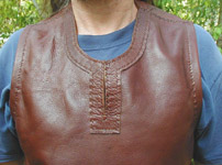 Our Champion's Surcoat features a trimmed, hand-stitched keyhole neckline. Armholes are folded under and hand sewn for a great finished look