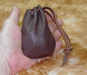 Drawstring Coin Pouch shown holding 20 dollars in quarters with room to spare.