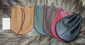 Large Drawstring Pouches shown in Tan, Green, Brown, Brick & Black.