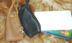 Hand Stitched Reliquary Neck Pouches shown in tan & black leather.