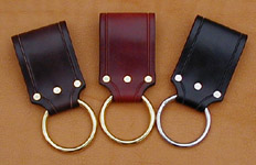 Our Ring Frog fits belts up to 2-1/2 inches wide. Shown here in dark brown, chestnut, and black leather. Your choice of nickel or brass ring.
